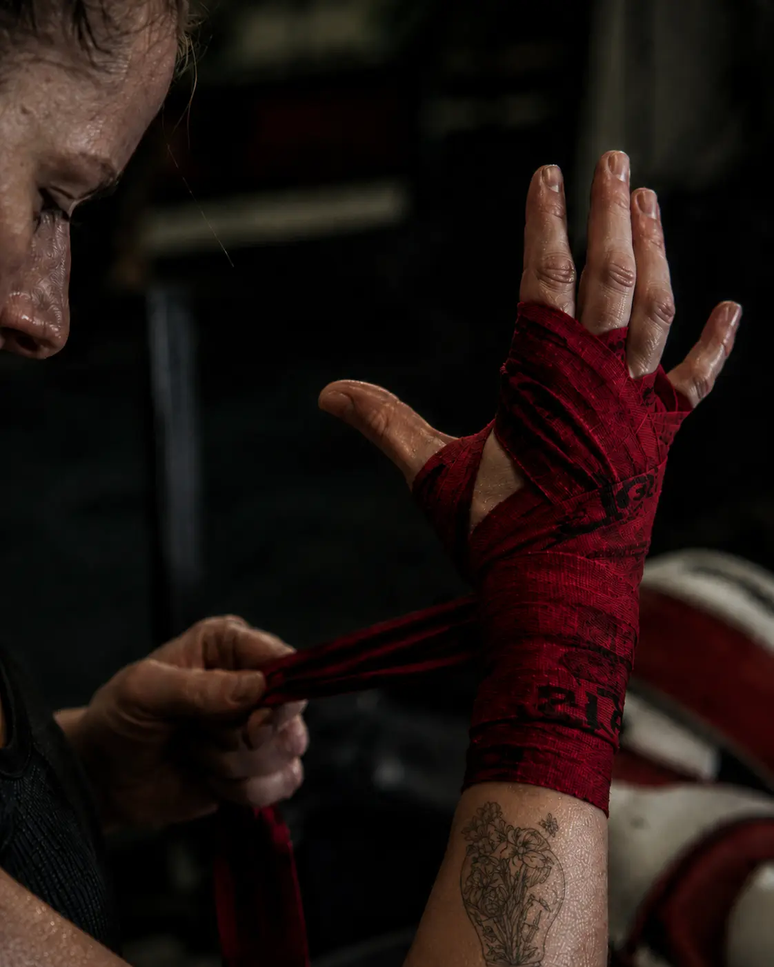 Close-up of wrapped hands in low light